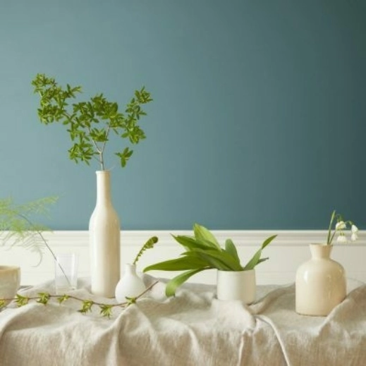 Showcase of a Vignette Aegean Teal colored wall behind a table