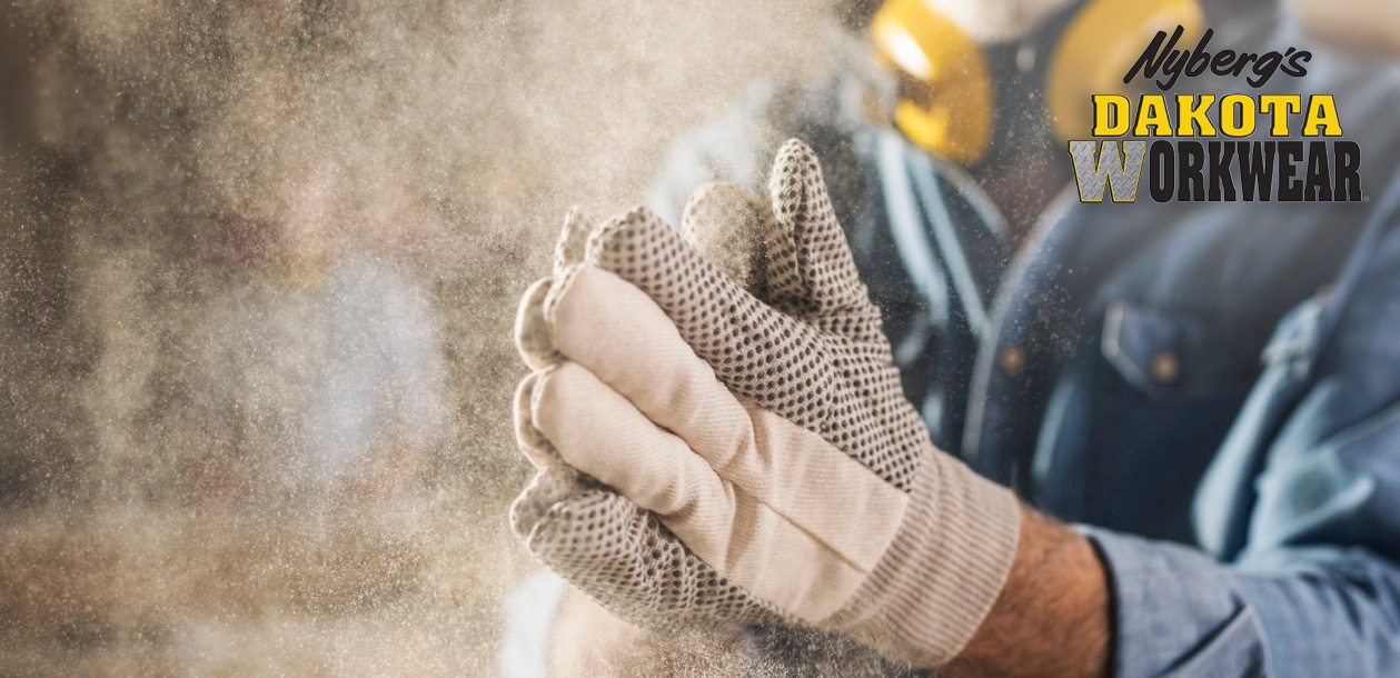 Man working with Dakota Workwear gloves on